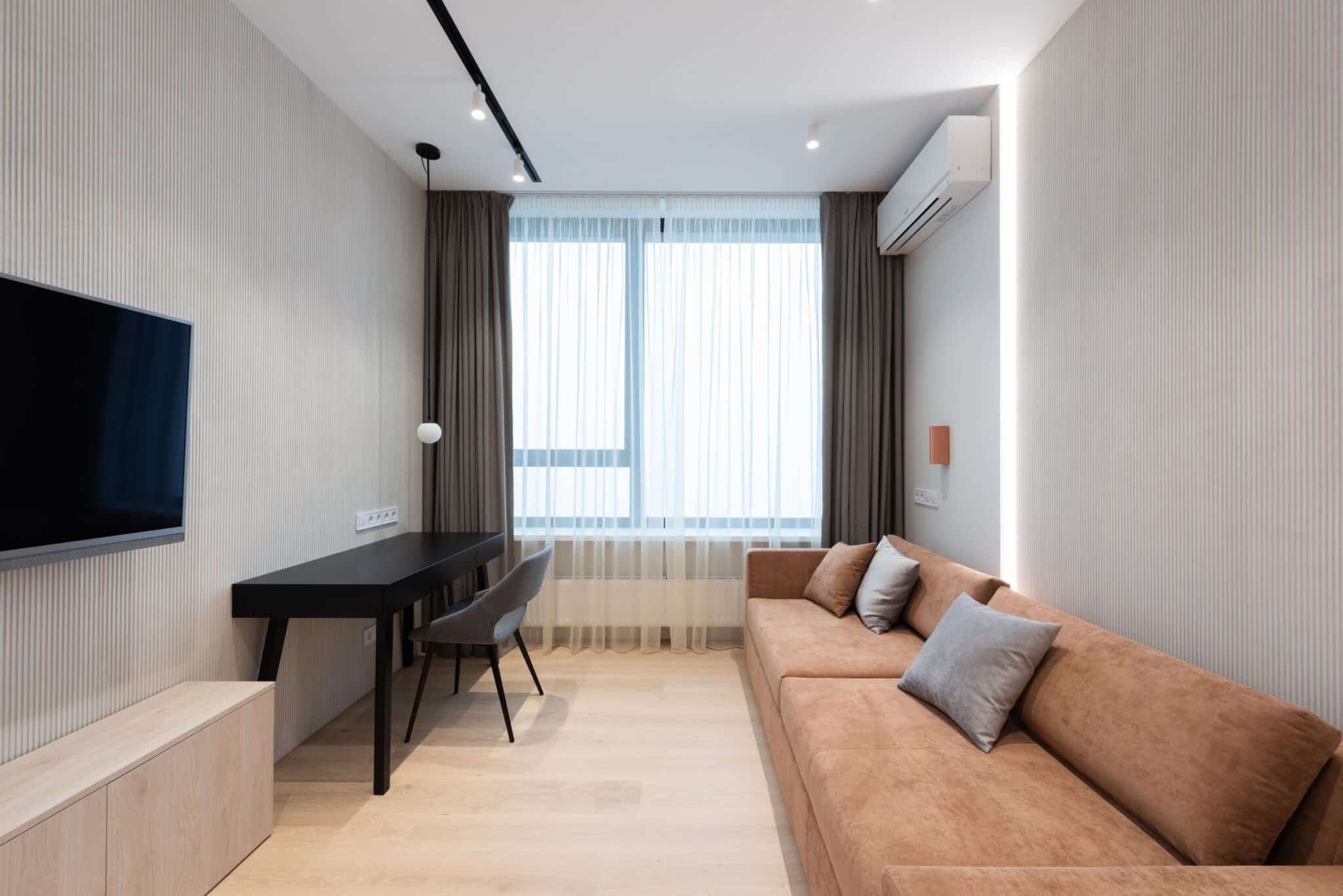 Modern living room cooled by a wall-mounted ductless mini split